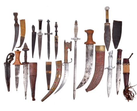  A small collection of knives and daggers, including: an African dagger, the hilt of nimcha form, wooden hilt and scabbard in