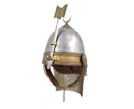  A 19th Century Egyptian helmet of the Khedive's bodyguard, tall steel skull surmounted by a crescent finial to a brass base,