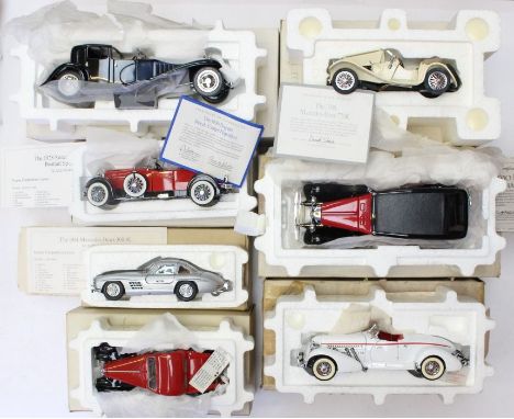 Franklin Mint: A collection of seven boxed Franklin Mint vehicles to include: Mercedes-Benz 770K, 1930 Bugatti, Stutz; Merced