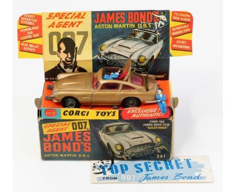 Corgi Toys 261 Special Agent 007 James Bond's Aston Martin D.B.5. from the James Bond film "Goldfinger", gold body with red i