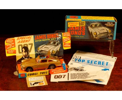 Corgi Toys 261 Special Agent 007 James Bond's Aston Martin D.B.5. from the James Bond film "Goldfinger", gold body with red i