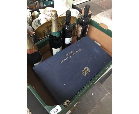 Box of champagne, wine and crystal glasses 