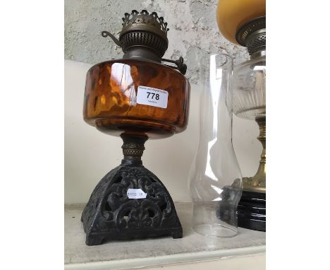 Cast and amber glass oil lamp with funnel 