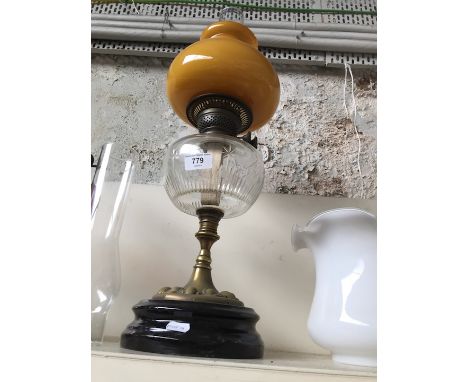 Brass and glass oil lamp with orange shade and funnel 