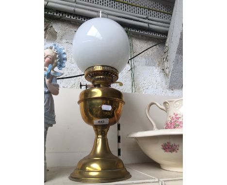 Brass oil lamp with white glass shade 