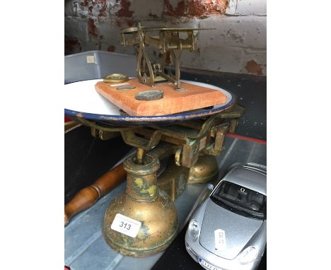 A cast iron set of scales with enameled pan along with a set of letter scales. 