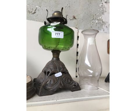 cast and green glass oil lamp with shade 