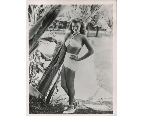 Rita Hayworth signed and dedicated 8x6 vintage black and white photograph. Hayworth achieved fame during the 1940s as one of 