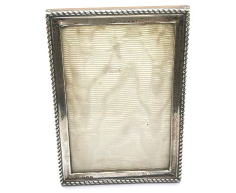 Hallmarked silver photograph frame, Birmingham assay, 11 x 15 cm. P&amp;P Group 1 (£14+VAT for the first lot and £1+VAT for s
