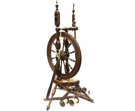 Spinning wheel in oak with accessories. P&amp;P Group 3 (£25+VAT for the first lot and £5+VAT for subsequent lots) 