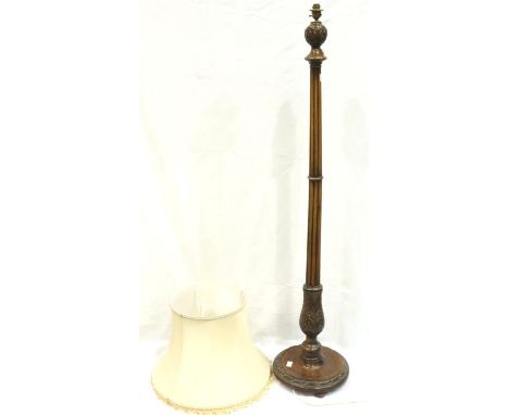 Early 20th century walnut standard lamp, the reeded column supported on a circular base and carved with acanthus leaves, H: 1