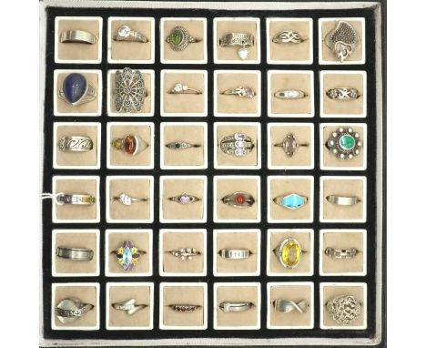 Thirty six 925 silver rings of varying designs and sizes to include stone set examples. P&amp;P Group 1 (£14+VAT for the firs