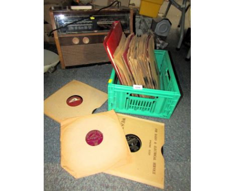 A KB vintage radio, together with various records. 