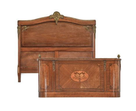 A French Louis XV-Style Mahogany, Tulipwood-Banded and Gilt Metal-Mounted Double Bedstead, late 19th century, the panelled he