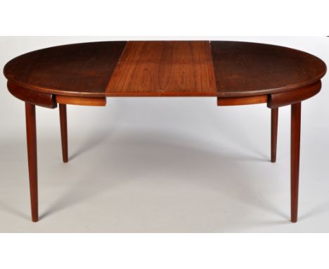 Frem Rojle, probably designed by Hans Olsen: a Danish teak dining table and six chairs, c.1960's, the circular extending dini
