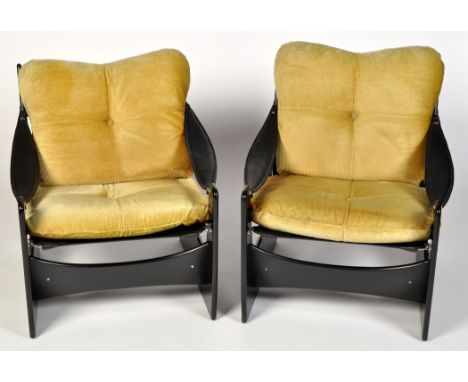 Attributed to Howard Keith for HK Furniture: a pair of ebonised armchairs with padded leather arms, patent leather seat by Pi