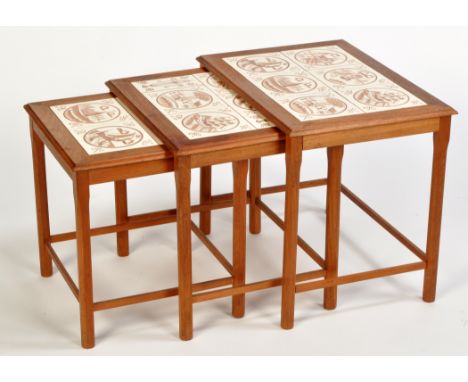 A teak nest of tables, each set with hand-painted ceramic tiles to top, 55cms (21 1/2in.) wide.