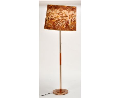 A teak and metal lamp standard, c.1970's, floral shade, 142cms (56in.) high.