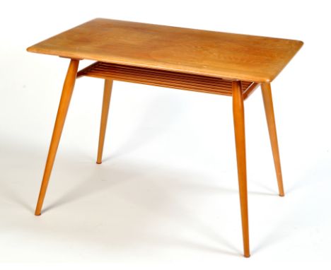 Manner of Ercol: a light stained elm table, the rectangular top raised on turned tapering legs joined by spindle undertier, 9