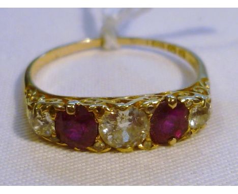 Edwardian diamond and ruby ring, three diamonds interspersed with two rubies, the largest diamond approx 5mm diameter, on 18c