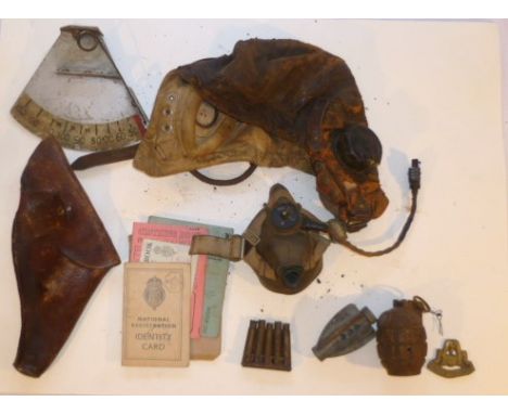 WWII RAF leather flying helmet with electrics and oxygen mask, together with grenade and bullet casings, leather pistol holst