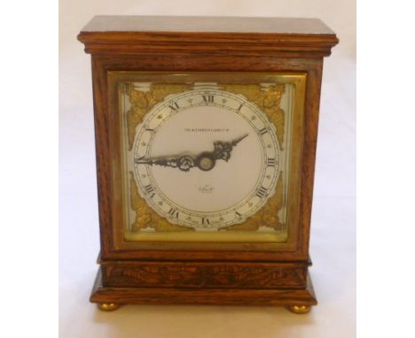 Alexander Clark oak cased mantel clock, silvered dial with gilt winged cherub spandrels, English escapement, 17cm high