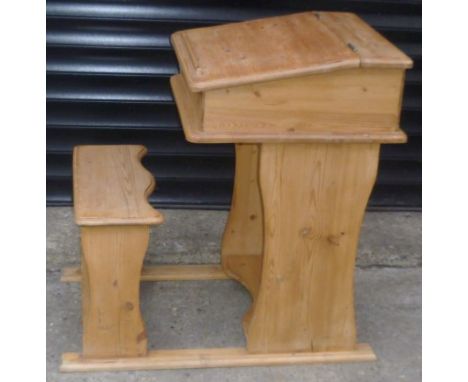 Child's pine desk, sloping front with hinged top, integrated with bench seat