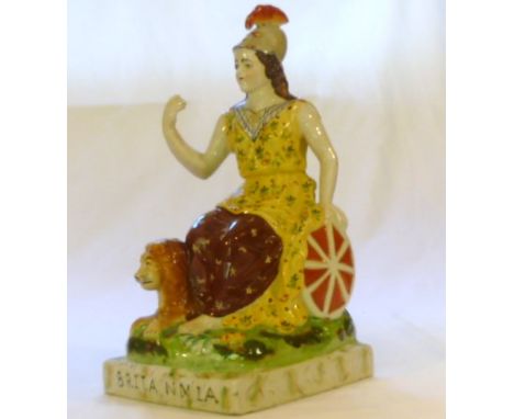 Large 19th century Staffordshire ceramic figure of Britannia with shield to her side and lion at her feet, 37cm high