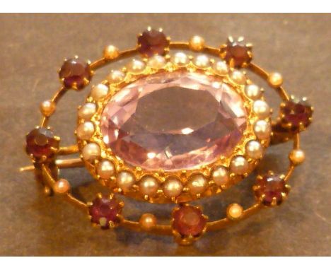 Amethyst and pearl brooch mounted on a 15ct gold setting, the large central oval brilliant cut amethyst, 15mm long, surrounde