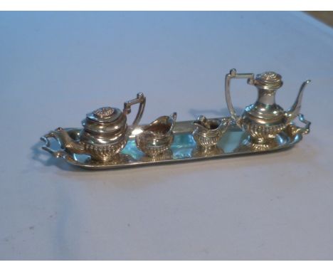 Miniature silver hallmarked five piece tea / coffee service, the twin handled tray 15cm long, marks for Birmingham 1973, make