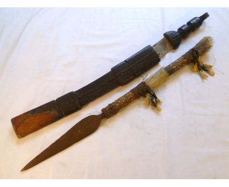 African tribal spear head, the handle painted and hung with beads and bone fragments, 57cm long, together with a tribal mache