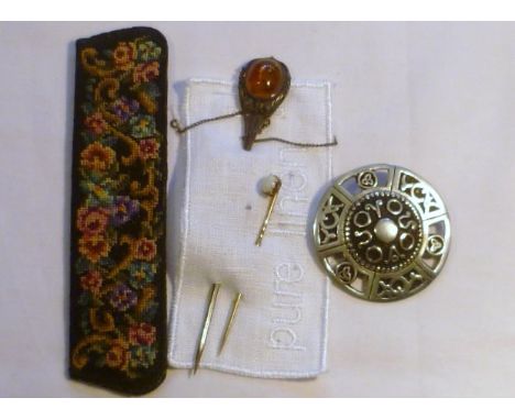 Gold stick pin set with an opal, together with a larger 925 silver lapel brooch set with an amber, and a Cornish pewter brooc