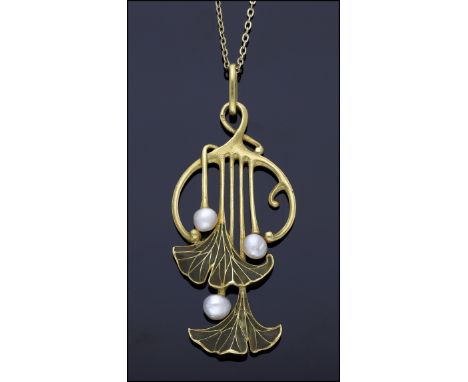A French Art Nouveau enamel and pearl pendant by Georges Le Turcq, circa 1900, the gold foliate pendant formed of entwined te