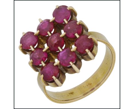 A ruby dress ring by Emil Lettré, the nine round faceted rubies claw-set in a uniform lattice formation, yellow precious meta