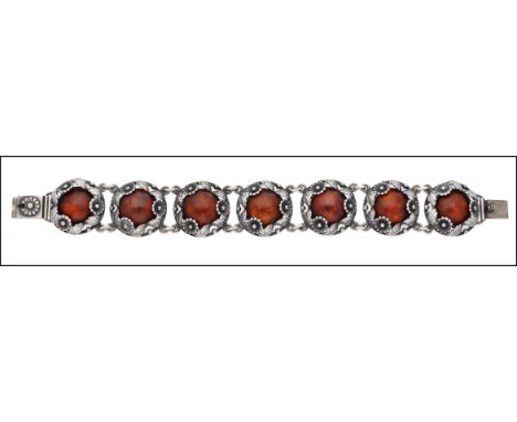 A Danish silver and amber bracelet by Niels Erik From, circa 1950, designed as a series of seven circular plaques, each set w