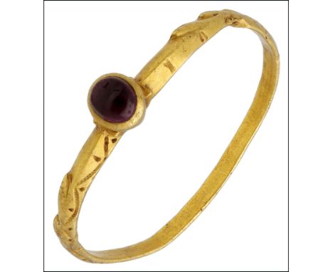 A late 13th/early 14th century gold and garnet posy ring, centred with an oval small cabochon almandine garnet, within a cone