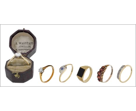 A collection of six rings, including two diamond single stone rings, a sapphire and diamond ring, an onyx mounted ring with t