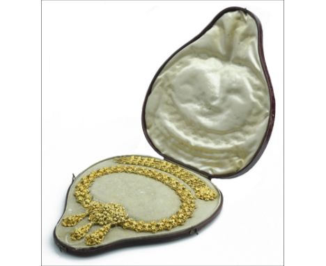 A mid 19th century gold necklace and bracelet suite, circa 1840, composed of ornate repoussé work, the broad collar with cent