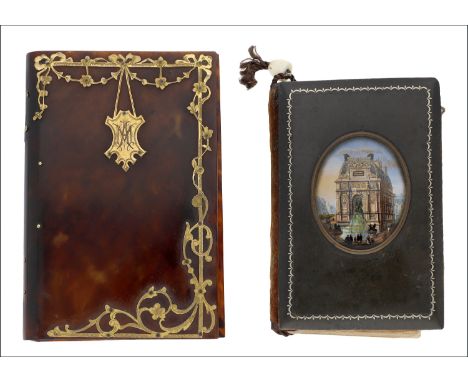 A tortoiseshell and ivory aide memoire, the tortoiseshell cover with applied gilt metal decorative border suspending central 