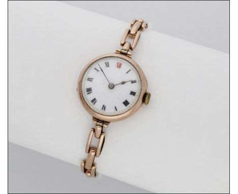 Swiss. A lady’s gold wristwatch with bracelet, circa 1908 Movement: manual winding, 15 jewels Dial: white enamel, Roman numer