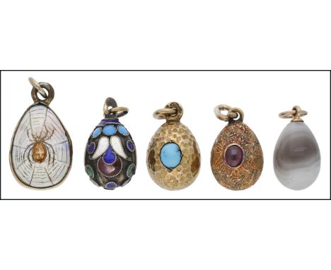 Four Russian egg charms, circa 1900, comprising a late 19th century silver egg decorated with polychrome cloisonné enamel, be