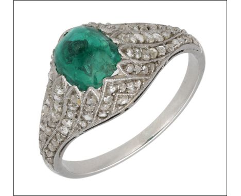 A Colombian emerald and diamond ring, circa 1915-20, the sugarloaf cabochon emerald set within raised rose-cut diamond mount 