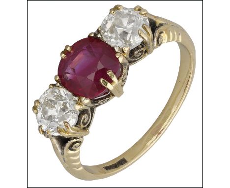 A late 19th century ruby and diamond ring, the cushion-shaped ruby with an old brilliant-cut diamond to either side, the gall