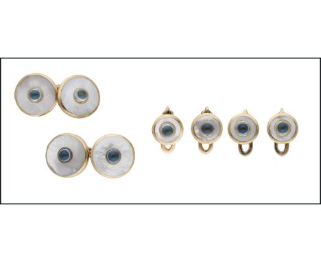 A 9ct gold and mother-of-pearl dress set, comprising a pair of cufflinks and four studs, the mother-of-pearl panels centred w