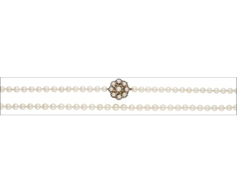 A single row cultured pearl necklace, the uniform strand of pearls terminating in a scallop-edged pearl and single-cut diamon