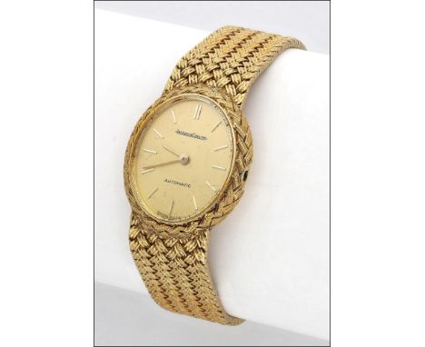 Jaeger-LeCoultre. An oval lady’s gold automatic bracelet watch, circa 1990 Movement: automatic, 24 jewels Dial: gilt, baton i