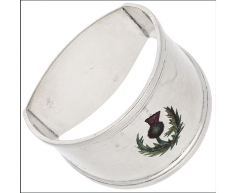 A silver and enamel ‘thistle’ napkin ring, centred with an enamelled thistle motif, Birmingham, marks rubbed, length 48mm. £3