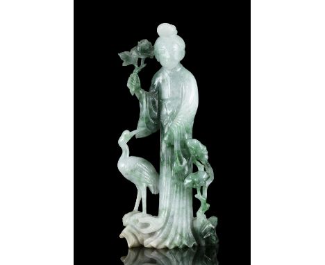 AN APPLE GREEN AND EMERALD ACCENTS JADEITE JADE ‘MEIREN AND CRANE’ GROUP China, 20th century, Possibly dating to the 1970s Ca