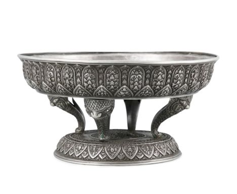 A CHISELLED SOLID SILVER COMMEMORATIVE CUP Thailand / Siam, Indochina, February 1938The cup of circular form, resting on four