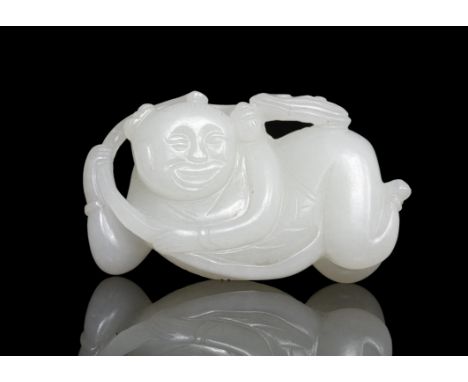 A ‘BOY AND LINGZHI’ WHITE JADE CARVING China, Attributed to Qing DynastyThe jade figure is carved in the round out of a white